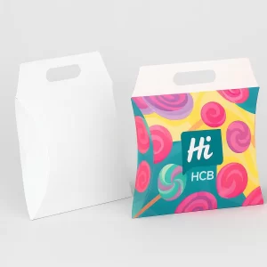 Elegant candy pillow boxes featuring heart-shaped windows and a decorative teal swirl design with scalloped edges