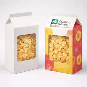 Gable top white and colourful cereal boxes featuring a transparent window to showcase fresh corn flakes.