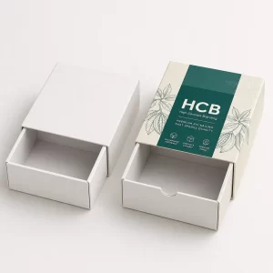 Luxury white and teal branded cardboard drawer boxes featuring a slide-out mechanism for premium product presentation.