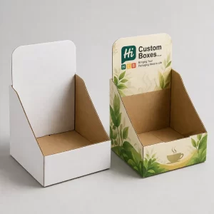 Cardboard counter display units for tea boxes including a white mock-up and a custom printed version.