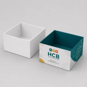Sustainable square two-piece packaging boxes featuring a plain white version and a branded teal patterned option.