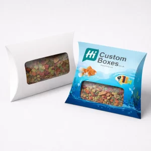 Two white vertical boxes with die-cut windows, one featuring a colourful underwater fish design.