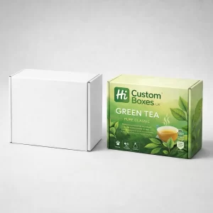 A white mailer box next to a printed version featuring green tea leaves and a cup.
