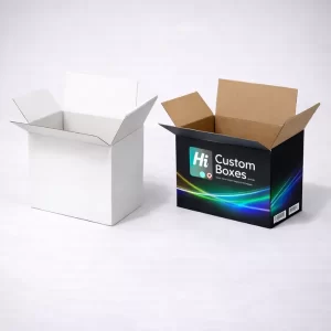 An open plain white cardboard box next to a branded black box with a brown interior.