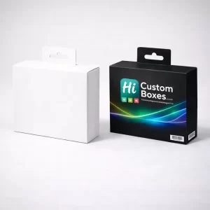 Two small rectangular boxes with hanging tabs, one plain white and one printed black with branding.
