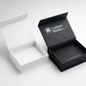 Two premium magnetic flip-top boxes displayed open, featuring a white luxury finish and a black executive edition.