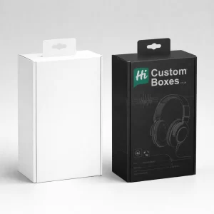A plain white retail box with a hanger tag beside a black box featuring headset illustrations.