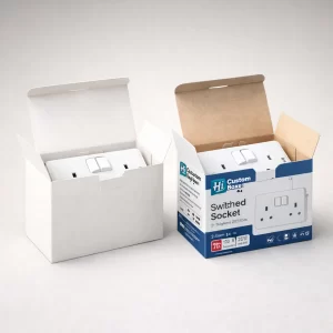 Two open cardboard boxes, one plain white and one branded blue, each containing a double-switched socket.