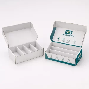 Two white mailer boxes with internal partitions and one showing professional branding with handling icons.