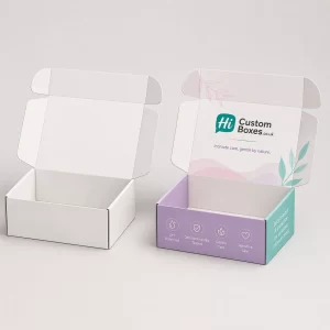 A plain white retail box standing next to a purple floral branded intimate cream box.