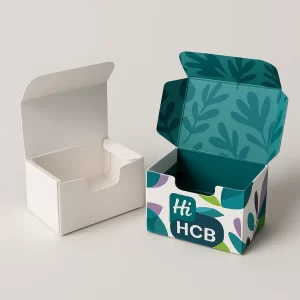 Small white and brightly branded folding soap boxes- open- showing a custom die-cut top