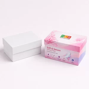 Two closed cardboard boxes, one plain white and one with pink floral designs and branding.