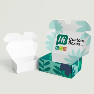 Open small white and printed flip-top mailer-style boxes with a floral pattern