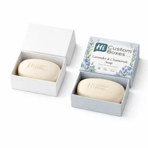 Luxury white and lavender-themed soap boxes containing oval-shaped bars of handmade lavender and chamomile soap.