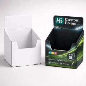 Two counter display boxes with open fronts, showing a plain white version and a branded green design. class=