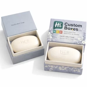 Premium blue floral-patterned rigid boxes with a neck-style lid, housing embossed handcrafted bars of soap.