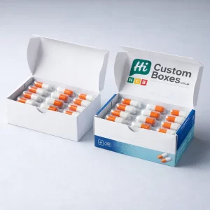Two open white hinged boxes containing orange and white capsule blister packs with branded interiors.