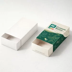 Two white sliding drawer boxes, one plain and one featuring green botanical herbal supplement branding.